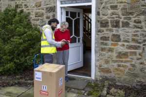 ULT232 Elderly Lady Answering Door Hark! How the doorbell rings: Ultralife helps prepare homes for receiving festive deliveries
